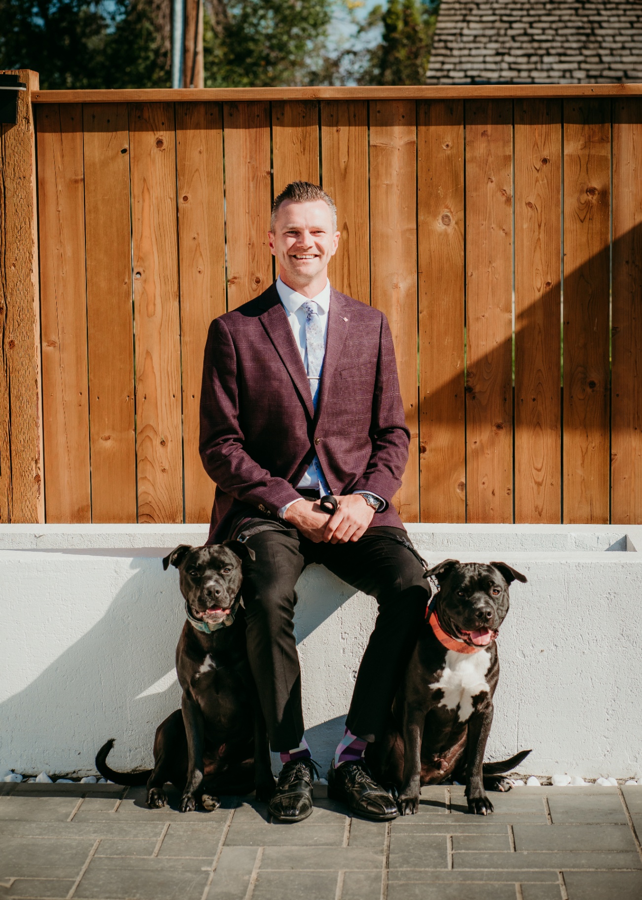 Jordan Bird, Lloydminster real estate agent, with his two dogs